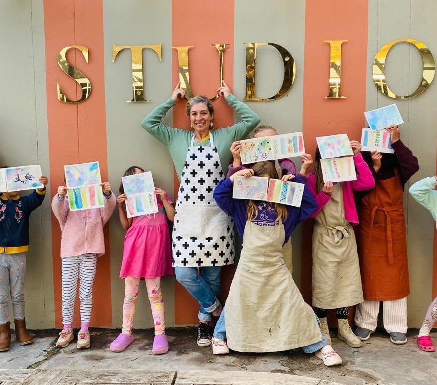 Janice Grant with her Young Artists class outside the SA Art Fair studio in Hout Bay